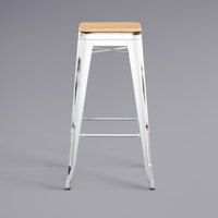 Lancaster Table & Seating Alloy Series Distressed White Stackable Metal Indoor Industrial Barstool with Natural Wood Seat