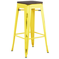 Lancaster Table & Seating Alloy Series Distressed Yellow Stackable Metal Indoor Industrial Barstool with Black Wood Seat
