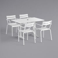 Lancaster Table & Seating 32 inch x 48 inch White Powder-Coated Aluminum Dining Height Outdoor Table with Umbrella Hole and 4 Arm Chairs