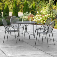 Lancaster Table & Seating Harbor Black 36 inch Round Outdoor Standard Height Table with Ornate Legs and 4 Arm Chairs