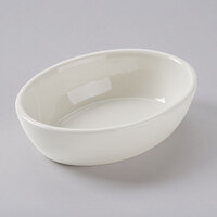 Tuxton BEK-160 16 oz. Eggshell Oval China Baker Dish / Bowl - 12/Case