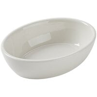 Tuxton BEK-160 16 oz. Eggshell Oval China Baker Dish / Bowl - 12/Case