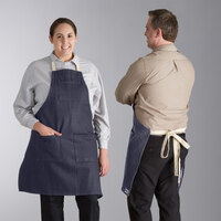 Acopa Kennett Blue Denim Adjustable Bib Apron with 3 Pockets and Natural Webbing - 32 inch X 30 inch