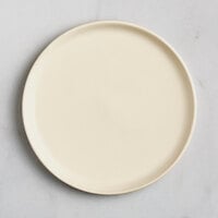 Acopa Pangea 6 1/2 inch Fog White Matte Coupe Porcelain Plate - 24/Case