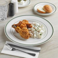 Tuxton TGB-021 Green Bay 12 inch Eggshell Wide Rim Rolled Edge China Plate with Green Bands - 12/Case