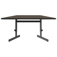 Correll 30" x 60" Trapezoid Walnut Finish 21" - 29" Adjustable Height Thermal-Fused Laminate Top Computer and Training Desk
