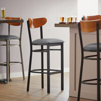 Lancaster Table & Seating Boomerang Bar Height Black Chair with Dark Gray Vinyl Seat and Cherry Back