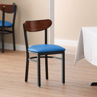 Lancaster Table & Seating Boomerang Black Finish Chair with 2 1/2 inch Blue Vinyl Padded Seat and Antique Walnut Wood Back