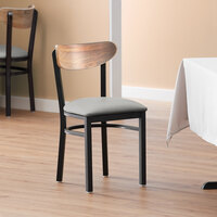 Lancaster Table & Seating Boomerang Black Finish Chair with 2 1/2 inch Light Gray Vinyl Padded Seat and Vintage Wood Back