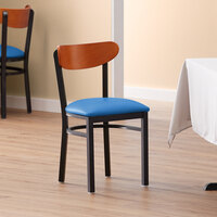 Lancaster Table & Seating Boomerang Black Finish Chair with 2 1/2 inch Blue Vinyl Padded Seat and Cherry Wood Back