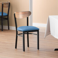 Lancaster Table & Seating Boomerang Black Finish Chair with 2 1/2 inch Blue Vinyl Padded Seat and Vintage Wood Back
