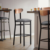 Lancaster Table & Seating Boomerang Bar Height Black Chair with Dark Gray Vinyl Seat and Vintage Wood Back