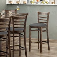 Lancaster Table & Seating Vintage Finish Wooden Ladder Back Bar Height Chair with Dark Gray Padded Seat - Detached Seat