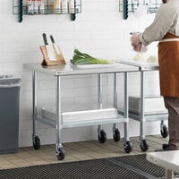 Regency 30 inch x 36 inch 18-Gauge 304 Stainless Steel Commercial Work Table with Galvanized Legs, Undershelf, and Casters