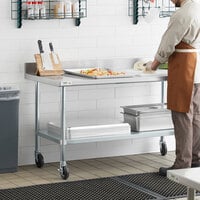 Regency 30 inch x 60 inch 18-Gauge 304 Stainless Steel Commercial Work Table with 4 inch Backsplash, Galvanized Legs, Undershelf, and Casters