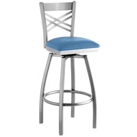 Lancaster Table & Seating Clear Coat Finish Cross Back Swivel Bar Stool with 2 1/2 inch Blue Vinyl Padded Seat
