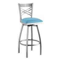 Lancaster Table & Seating Clear Coat Finish Cross Back Swivel Bar Stool with 2 1/2" Blue Vinyl Padded Seat