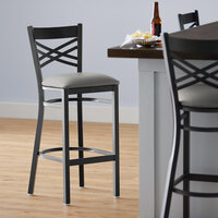 Lancaster Table & Seating Black Finish Cross Back Bar Stool with 2 1/2 inch Light Gray Vinyl Padded Seat - Detached