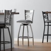 Lancaster Table & Seating Clear Coat Finish Cross Back Swivel Bar Stool with 2 1/2 inch Dark Gray Vinyl Padded Seat