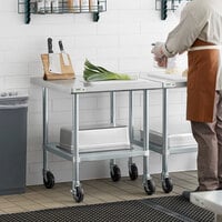 Regency 30 inch x 30 inch 18-Gauge 304 Stainless Steel Commercial Work Table with Galvanized Legs, Undershelf, and Casters