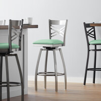 Lancaster Table & Seating Clear Coat Finish Cross Back Swivel Bar Stool with 2 1/2" Seafoam Vinyl Padded Seat