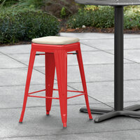 Lancaster Table & Seating Alloy Series Red Stackable Metal Indoor / Outdoor Industrial Cafe Counter Height Stool with Tan Fabric Magnetic Cushion
