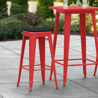 Lancaster Table & Seating Alloy Series Red Stackable Metal Indoor / Outdoor Industrial Barstool with Black Fabric Magnetic Cushion