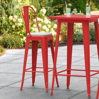 Lancaster Table & Seating Alloy Series Red Metal Outdoor Cafe Barstool with Tan Fabric Magnetic Cushion