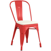 Lancaster Table & Seating Alloy Series Red Stackable Metal Indoor / Outdoor Industrial Cafe Chair with Vertical Slat Back and Tan Fabric Magnetic Cushion