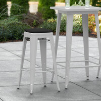 Lancaster Table & Seating Alloy Series Silver Stackable Metal Indoor / Outdoor Industrial Barstool with Black Fabric Magnetic Cushion