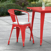 Lancaster Table & Seating Alloy Series Red Stackable Metal Indoor / Outdoor Industrial Cafe Arm Chair with Gray Fabric Magnetic Cushion