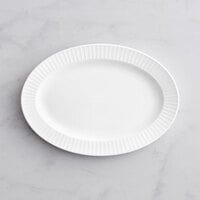 Acopa Cordelia 12 3/4" x 9" Bright White Embossed Wide Rim Porcelain Platter - 12/Case
