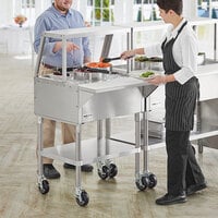 ServIt CFT2KA Stainless Steel 2 Pan Ice-Cooled Food Table with Angled Sneeze Guard and 5 inch Casters