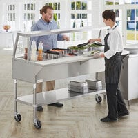 ServIt CFT5KA Stainless Steel 5 Pan Ice-Cooled Food Table with Angled Sneeze Guard and 5 inch Casters