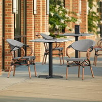 Lancaster Table & Seating Excalibur Bistro Series 27 1/2 inch Square Versilla Standard Height Table with 2 Black and White Arm Chairs