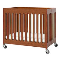 Foundations Boutique 24 inch x 38 inch Cherry Compact Slatted Wood Folding Crib with Oversized Casters and 3 inch InfaPure Mattress