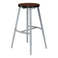 National Public Seating Titan 24" Gray Steel / Particleboard Lab Stool with Montana Walnut High-Pressure Laminate Seat