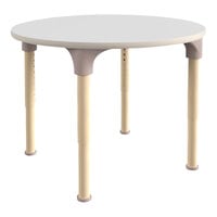 Flash Furniture Bright Beginnings 15"-23" Adjustable Height Round White / Beech Wooden Preschool Classroom Activity Table