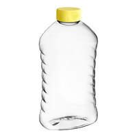 27 oz. (40 oz. Honey Weight) Ribbed Hourglass PET Honey Bottle with Heat Induction Seal Liner Yellow Plastic Flip Top Lid - 135/Case