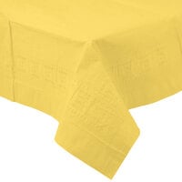 Creative Converting 710228 108 inch x 54 inch Mimosa Yellow Tissue / Poly Table Cover - 6/Case