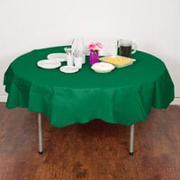 Creative Converting 923261 82 inch Emerald Green OctyRound Tissue / Poly Table Cover - 12/Case