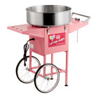 A pink cotton candy machine with a large stainless steel bowl and a wheeled cart.
