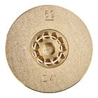 A gold circular brass disc with holes in it.