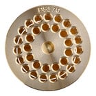 A gold plated circular metal pasta die with holes in it.