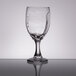 A Libbey wine glass with a design on it.