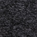 A close up of a black rubber-backed carpet.