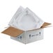 A white styrofoam container in a cardboard box.