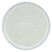 A white Cambro round tray with a white rim and text on it.