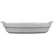 A white Tablecraft natural cast aluminum oval casserole dish with handles.