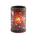 A close-up of a Sterno red beaded mosaic liquid candle holder with a lit candle inside.